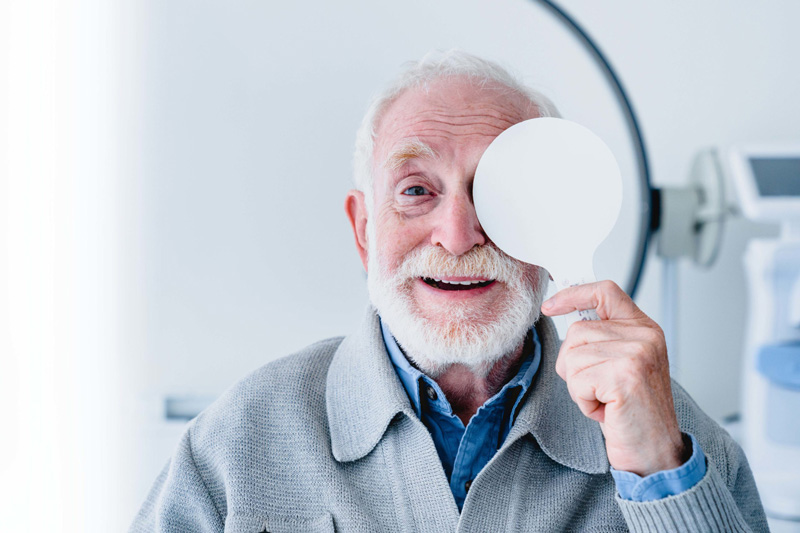 Elderly man taking macular degeneration test