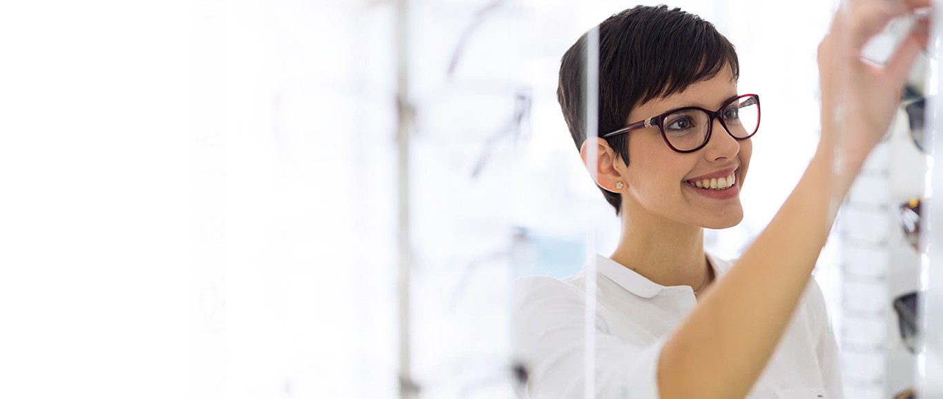 Woman selecting a new pair of designer eyeglasses