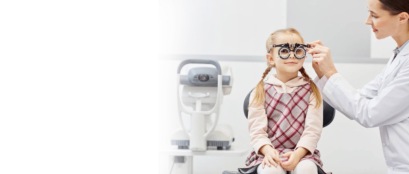 Eye doctor giving an eye check up to a child at Bristol Family Eyecare