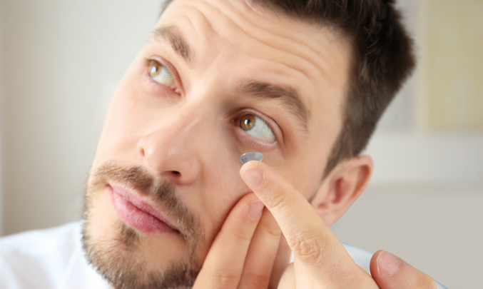 Man putting on some scleral lenses at Bristol Family Eyecare in Austin, TX